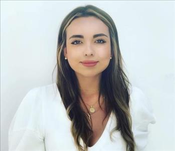 Women in futon of white wall 